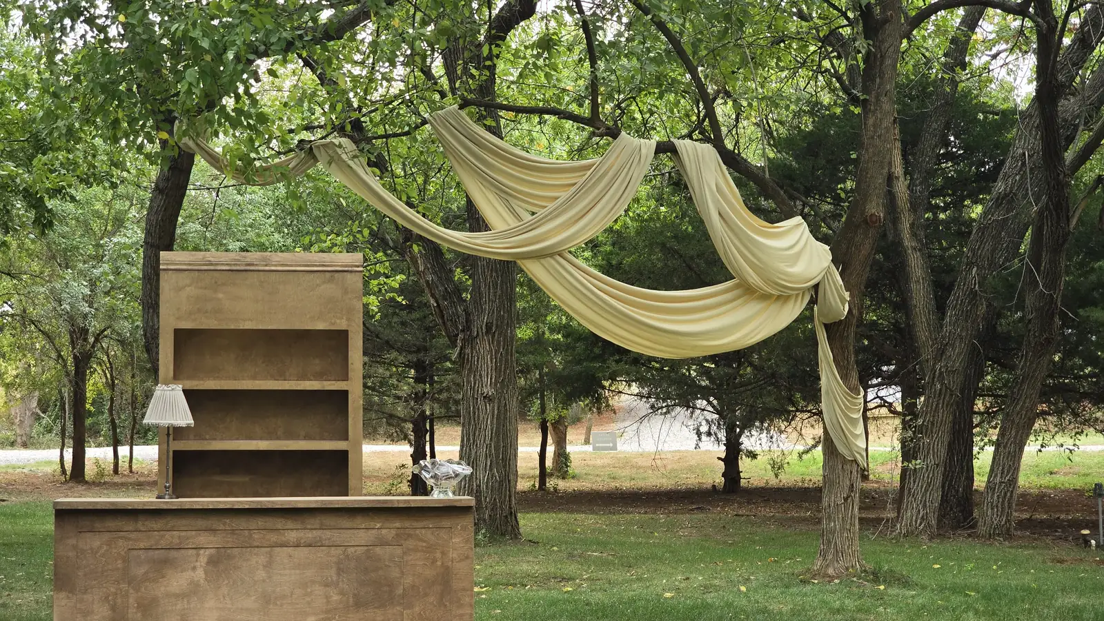 The bar set under a canopy of draped champagne fabric