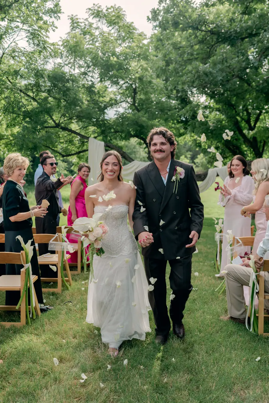 Rylee and Austin walk back down the aisle as husband and wife